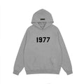 FEAR OF GOD FOG ESSENTIALS Flocked 1977 Loose High‑Street Hoodi